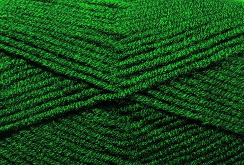 The texture of the wool blend yarn is dark green. Stock Photos
