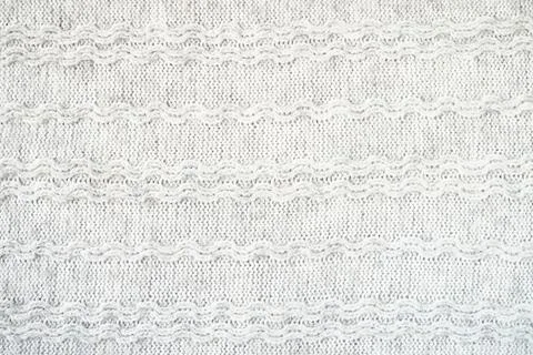 The texture of the woollen product. Grey background. Stock Illustration