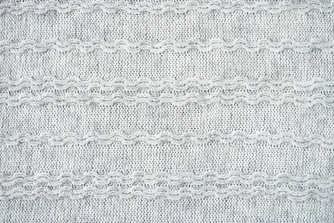 The texture of the woollen product. Grey background. Stock Illustration