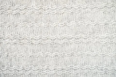 The texture of the woollen product. Grey background. Stock Illustration