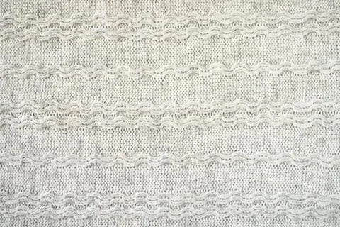 The texture of the woollen product. Grey background. Stock Illustration