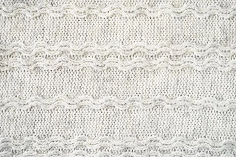 The texture of the woollen product. Grey background. Stock Illustration