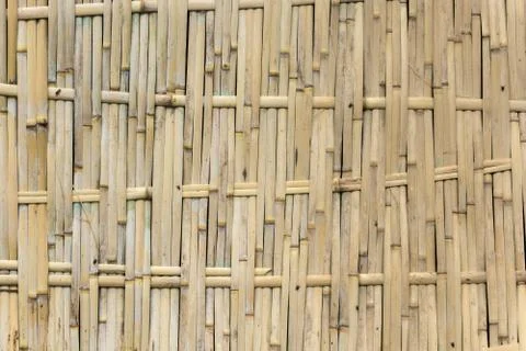 The texture of the woven wall of bamboo. Stock Photos
