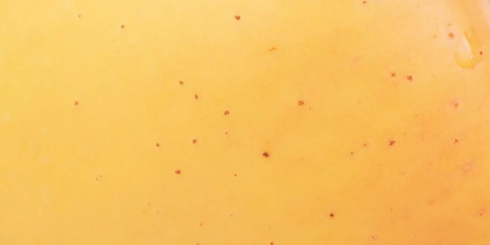 Texture of a yellow apple as a background macro photo. Stock Photos