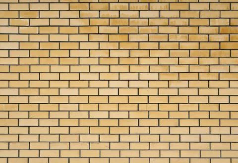 Texture of the yellow brickwork. Stock Photos
