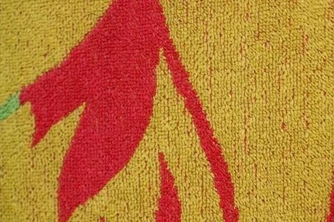 Texture of yellow fabric with red patterns Stock Photos