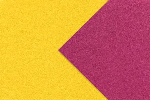 Texture of yellow paper background, half two colors with purple arrow Stockfoto's