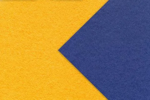Texture of yellow paper background, half two colors with navy blue arrow, mac Stockfoto's