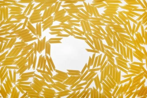 Texture of yellow pasta on a white background Foto stock