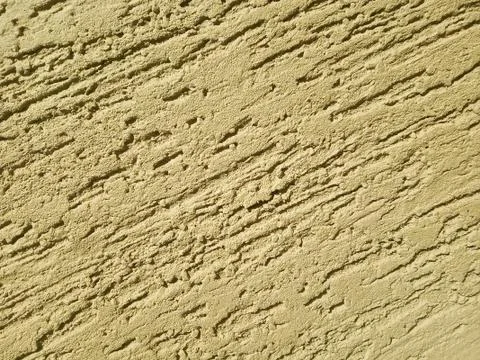 The texture of yellow plaster Stock Photos