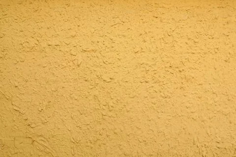 Texture of yellow plaster wall as background Foto stock