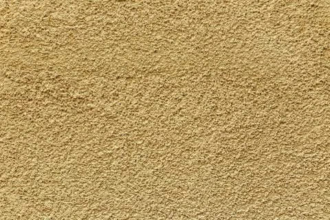 Texture yellow plastered wall for background. Yellow textured painted wall Foto stock