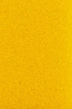 The texture of a yellow sponge. Close-up of sponge texture Stock Photos