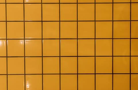Texture of Yellow square ceramic tile wall texture background, the wall of pool Foto stock