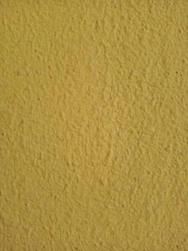 Texture of yellow stucco Stock Photos