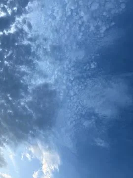Textured Altocumulus Cloud Field Across Blue Evening Sky Фото