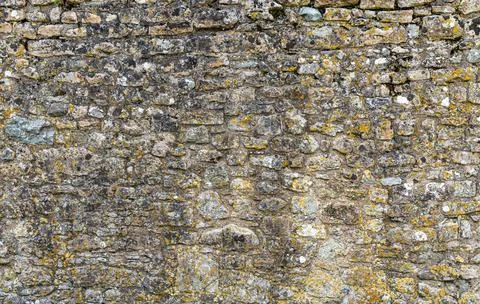 Textured and patterned Stone wall Stock Photos
