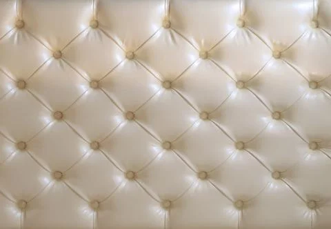 Textured Argyle pattern on a cream background, leather-based. Stock Photos