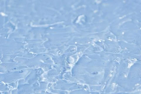 Textured backdrop of turquoise colored clear rippling water surface on beach Foto stock