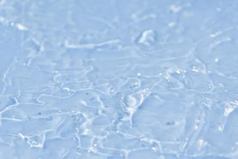 Textured backdrop of turquoise colored clear rippling water surface on beach 스톡 사진