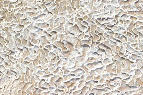 Textured background of asymmetric shape limestone deposits. Stock Photos