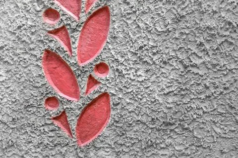 Textured background of cement with a pattern of red leaves on the border. Clo Stock Photos