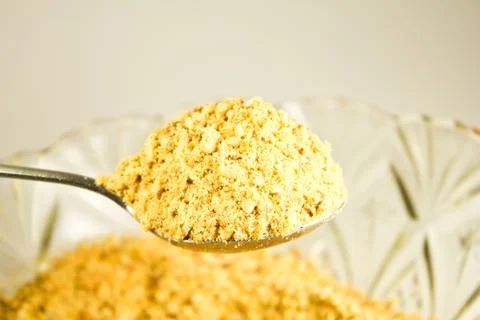 Textured background of crushed peanuts Stock Photos