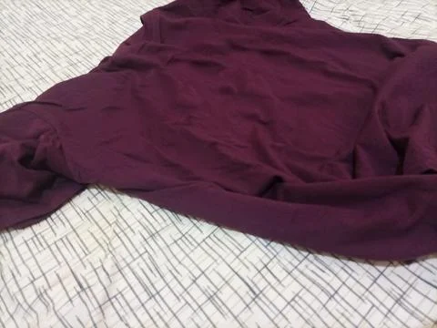 Textured background featuring a deep maroon or burgundy fabric Stock Photos