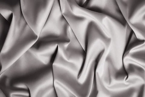 Textured background of gray silk or satin. Stock Photos