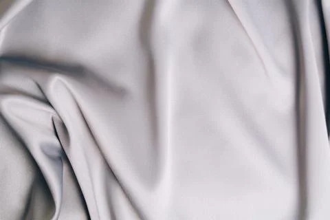 Textured background of gray silk or satin. Stock Photos