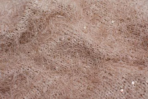 Textured background of knitted fluffy wool fabric. Stock Photos