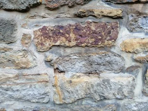 Textured background of the old stone wall. Stock Photos