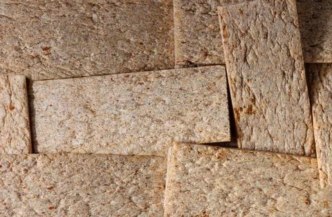 Textured background of overlapping whole grain crispbread crackers Stock Photos