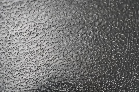 Textured background pattern on silver-colored metal. Light. Stock Photos