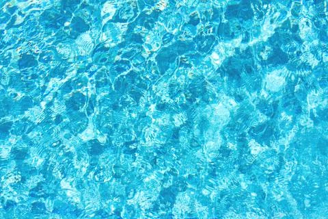 Textured background of pool water. Stock Photos