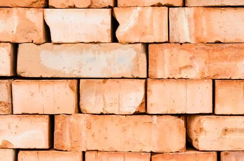 Textured background of stacked bricks Stockfoto's