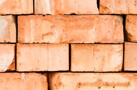 Textured background of stacked bricks Stockfoto's