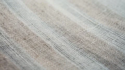 Textured beige fabric close up. Background and texture. Stock Footage 323305161