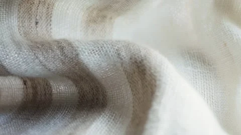 Textured beige fabric close up. Background and texture. Stock Footage 334772338