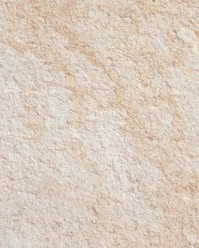 A Textured Beige Stone Wall Surface Stock Photos