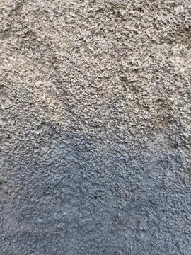 Textured between rough concrete and dark asphalt surface with asphalt texture Stock Photos