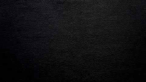 Textured black background with gray splashes. Stock Photos