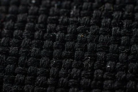 Textured black fabric with woven pattern showcasing fine craftsmanship and Stock Photos