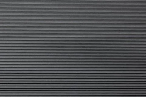 Textured Black Surface Showcasing Parallel Lines With Smooth Finish and Depth Stock Photos