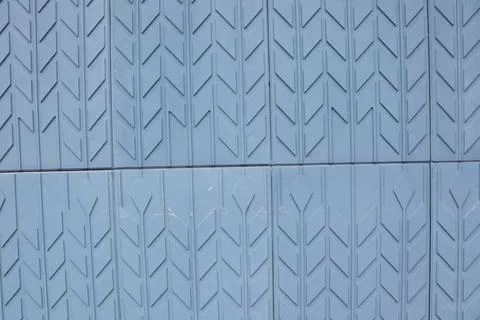 This is a Textured Blue Surface featuring an Arrow Pattern Design that Stock Photos
