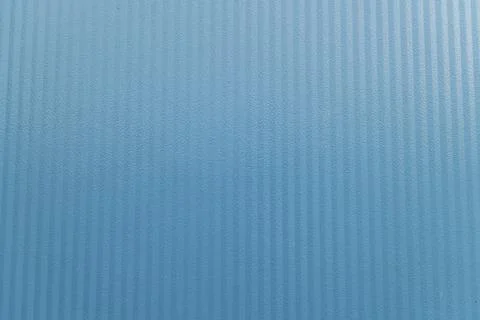 Textured blue surface featuring vertical lines creating a uniform pattern Stock Photos