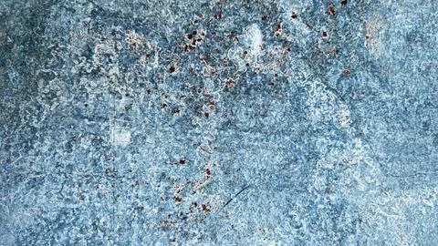 Textured blue surface with intricate patterns of rust and wear Stock Photos