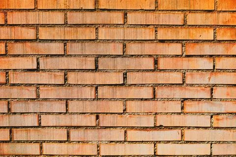 Textured brick wall with pattern of rectangular shapes Foto stock