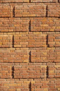 Textured brick wall in sunlight. background. copy space. Free space for text Stock Photos