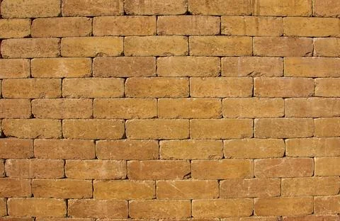 Textured brown background. Wall texture background. Brick wall construction.. Stock Photos